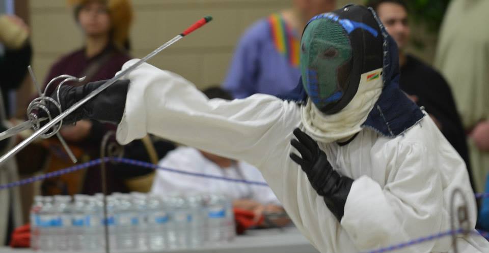 Joel at a fencing tournament